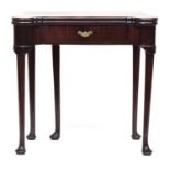 A George III mahogany card table, the shaped fold over top above single frieze drawer, raised on
