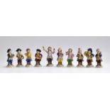 A set of ten Sitzendorf monkey band figurines, each marked to base, the tallest 11cm high (10)