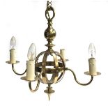 A brass four arm chandelier of central globe construction