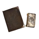 A silver repousse address book, marked William Comyns & Sons, London, 1905; together with a small