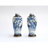 A pair of Chinese blue and white crackle glaze baluster vases, with incised Chenghua character