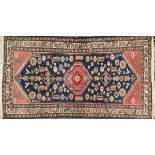 A West Persian rug with triple border, 191x102cm; together with a prayer mat, 120x88cm