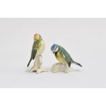 Two Karl Ens porcelain bird figurines, a blue tit, 7cm high, and another songbird, 10cm high, each