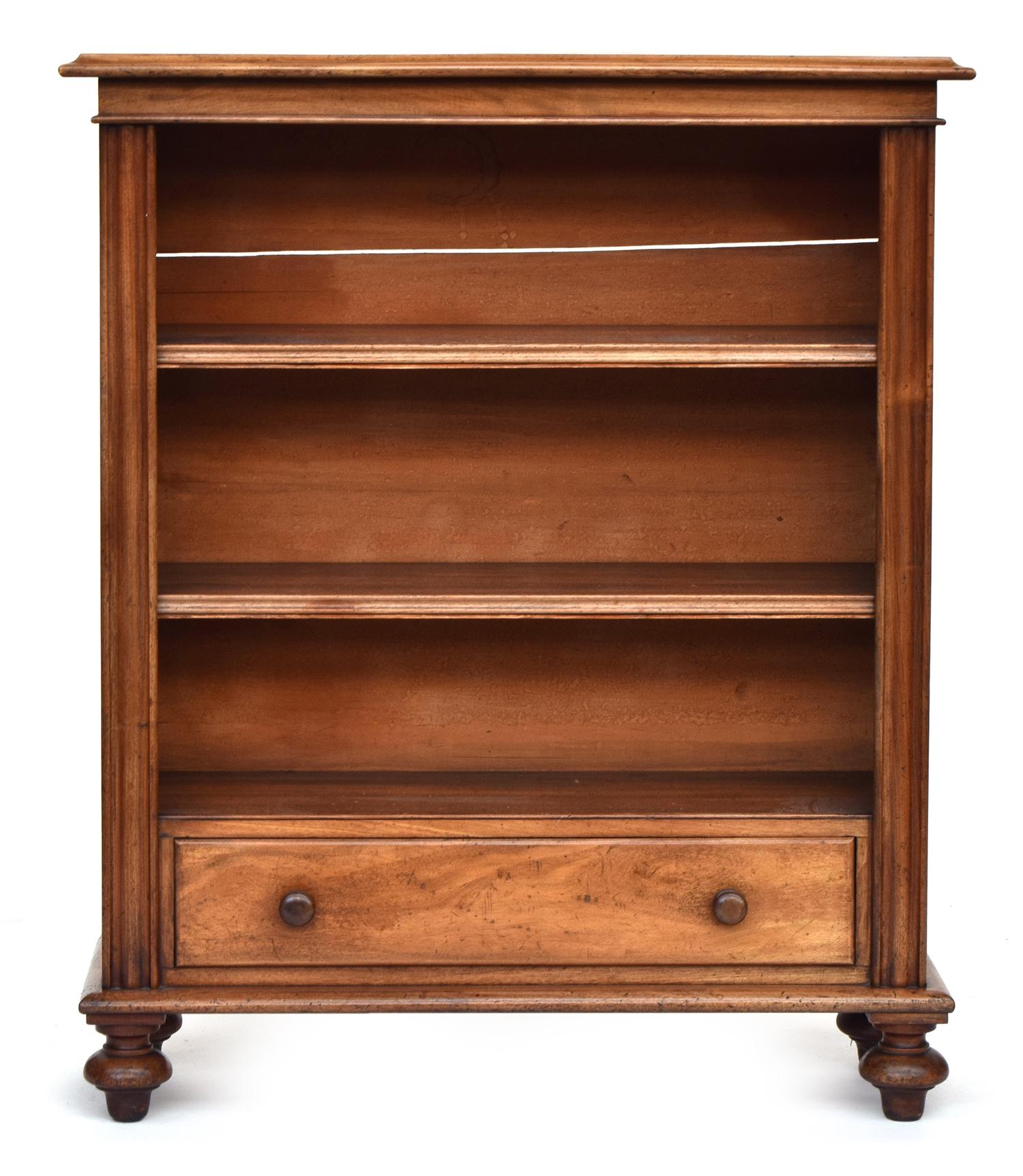 An Edwardian mahogany bookshelf with single drawer, on turned feet, 86cm wide, 30.5cm deep, 104cm
