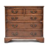 A mahogany chest of two short over three long drawers, with slide, on moulded base and bracket feet,