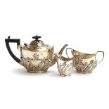 A late Victorian three piece tea set by Goldsmiths & Silversmiths Co., London 1899, the teapot