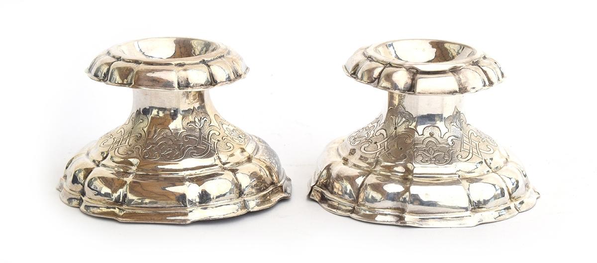 A pair of probably Indian silver salts, lightly chased with Eastern motifs, each approximately 6cm