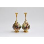 A pair of Royal Worcester bottle vases (af) heightened in gilt, hand painted with scenes of peacocks