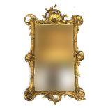 A Louis XVI giltwood wall mirror, with foliate cresting, replacement plate, 102cm high x 63cm wide