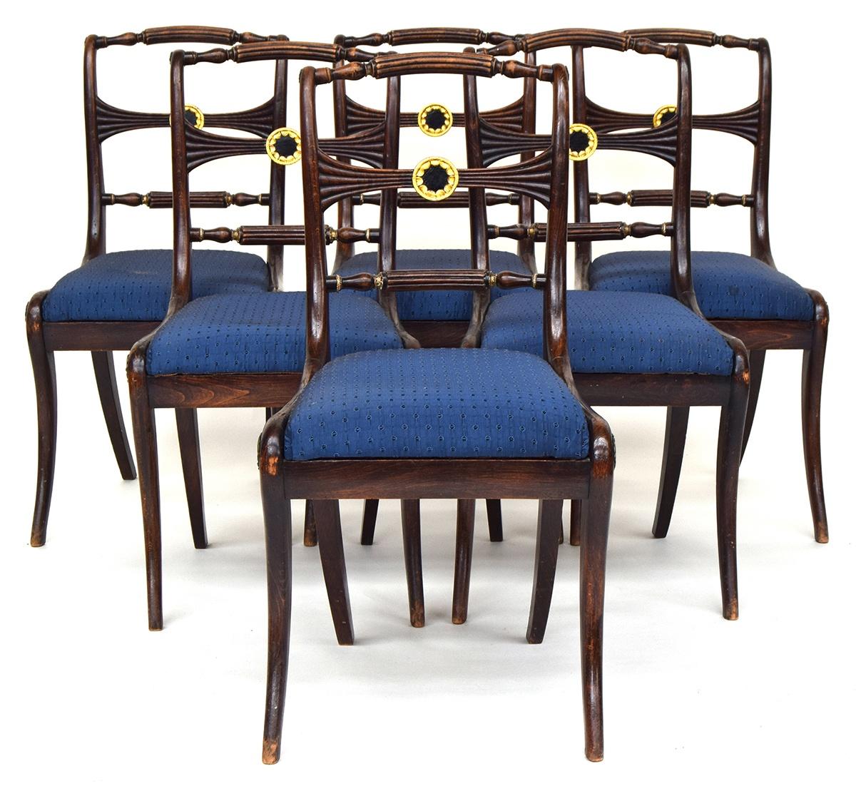 A set of six 19th century dining chairs, carved rail with parcel gilt rosette decoration, over