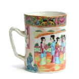 A Cantonese famille rose cylindrical mug, decorated with court scenes, heightened in gilt, 13cm high