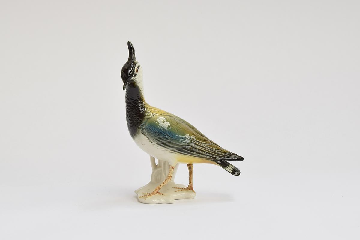A Karl Ens porcelain figurine of a lapwing, marked to base, 19cm high