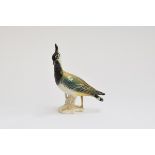 A Karl Ens porcelain figurine of a lapwing, marked to base, 19cm high