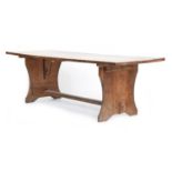 A large oak farmhouse refectory table, four plank top with wrought iron brackets, 245cm long, 87cm