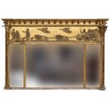A Regency giltwood and gesso overmantel mirror with applied balls above a frieze of charioteers, the