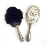 Two Victorian silver dressing hand mirrors: one by Henry Matthews, Birmingham 1898, bevelled oval