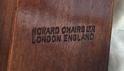 An armchair and matching footstool by Howard & Sons, on square tapered legs with brass cappings - Image 4 of 4