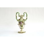 A Coalbrookdale style urn shaped vase, the handles decorated with acorns and heightened in gilt,