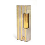 A steel and gold plated Dunhill Rollagas lighter with indented gold stripes