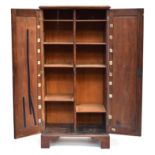 A late 19th century cabinet, two panel doors opening to reveal centrally divided adjustable shelves,