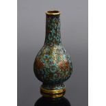 A small 18th century enamelled Chinese cloisonné vase, decorated with a scrolling lotus on a