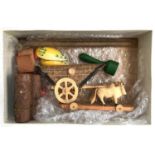 A carved wooden toy horse and cart, toy log pile etc; together with a bouquet of plastic flowers