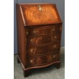 A walnut bureau with key, fall front over four drawers, on bracket feet, 53.5cmW