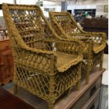 A close pair of yellow painted wicker child's chairs