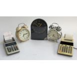 Two vintage printing calculators, two alarm clocks and one other
