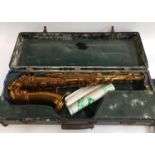 A saxophone marked 'The Silver King', in hard case