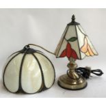 A modern table lamp with Tiffany style shade, together with a similar hanging lamp shade