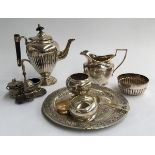 A small lot of played items to include three piece coffee set, chased dish, various cruet items, etc