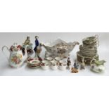 A mixed lot of ceramics to include two continental style figurines of a gentleman and lady, each