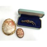 A cameo brooch depicting the Three Graces, silver with gold rope decoration with further large cameo