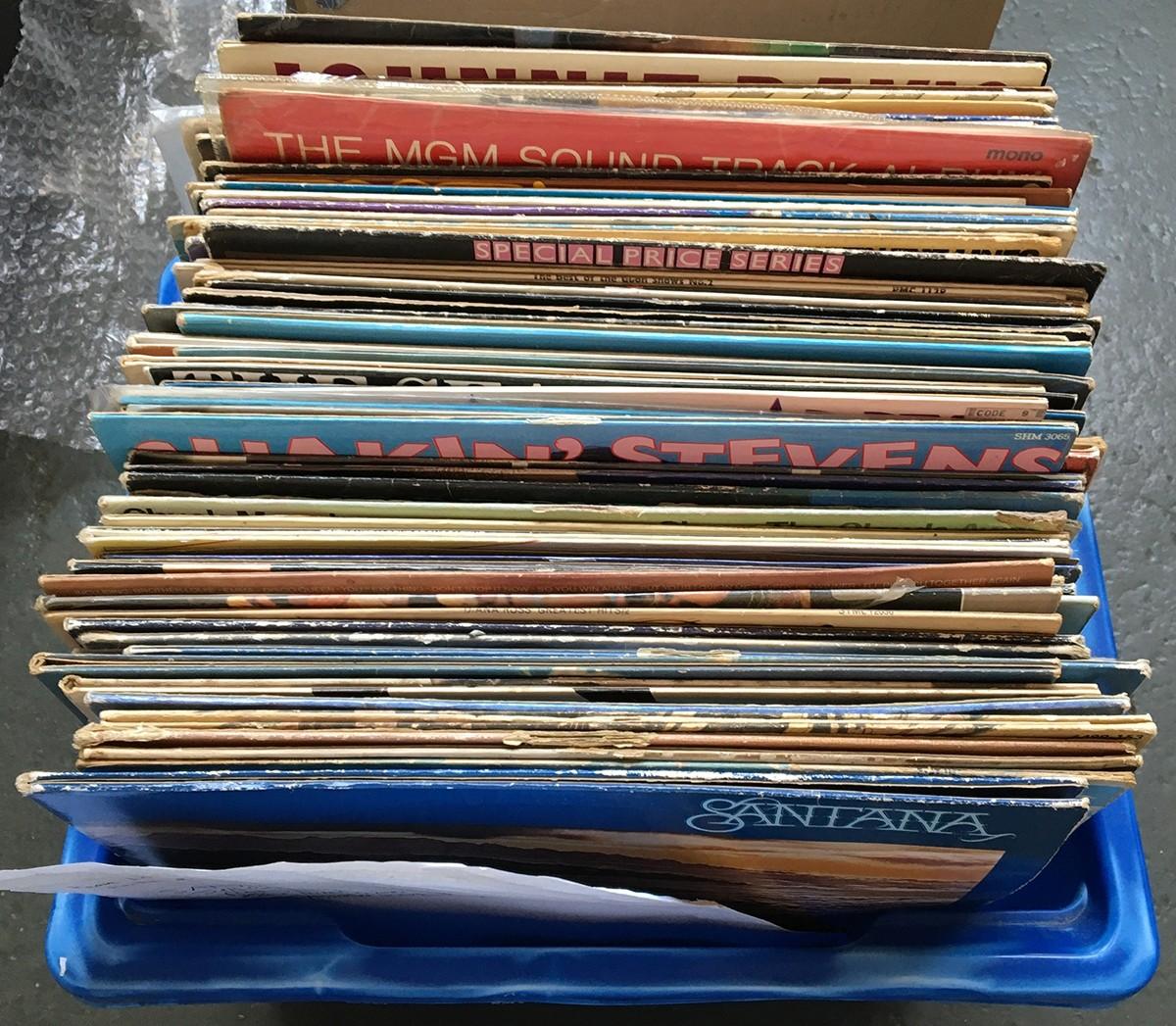 A mixed lot of rock and pop LPs to include Santana, Jeff Beck, Rod Stewart, Status Quo, etc
