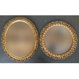 Two gilt framed wall mirrors, one oval with bevelled glass, 62x52cm; the other circular with