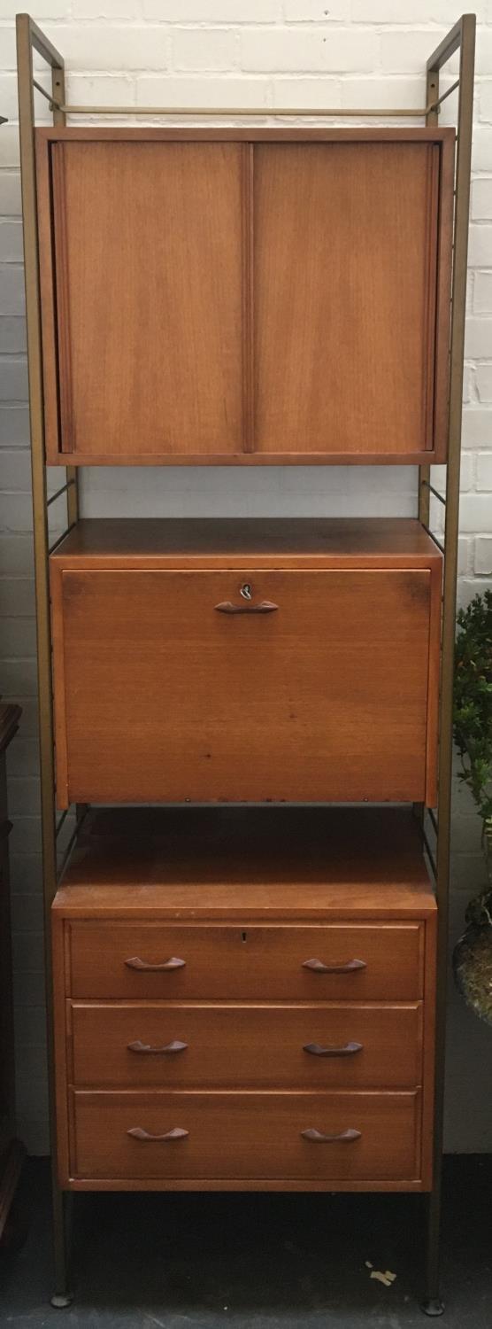 An unusual mid-century three-part unit comprising two cupboards over three drawers, teak and