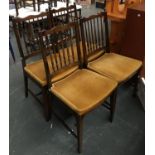 A set of four stag dining chairs