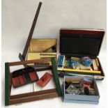 A mixed lot of drawing implements and other stationary; to include oak book rest; briefcase