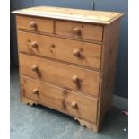 A Victorian stripped pine chest with two short over three long drawers, separating into two parts,