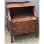An early 19th century oak commode/bedside cabinet, with two hinged tiers