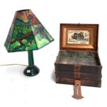 An Art Deco style table lamp; together with an Art Nouveau style metamorphic tin sewing box, 26.5cmW