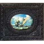 A lacquered print of a Dutch boat at sea, 12x16cm, within a very heavy and intricately carved