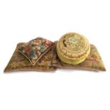 A pair of needlework cushions; together with two others (4)