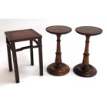 A pair of turned rosewood candle stands, with dish top, each 18.5cmH; together with a miniature