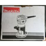 A Makita trimmer/router RT0700C, new in box