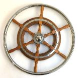 A wooden and chrome metal ships wheel, 65cmD