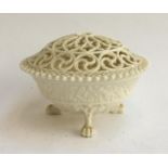 A Royal China Works Worcester pot pourri bowl glazed in white with floral design, marked to base '