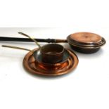 A long handled copper bed warming pan; together with a copper plate 34cmD, copper skillet with brass