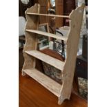 A small set of pine hanging shelves